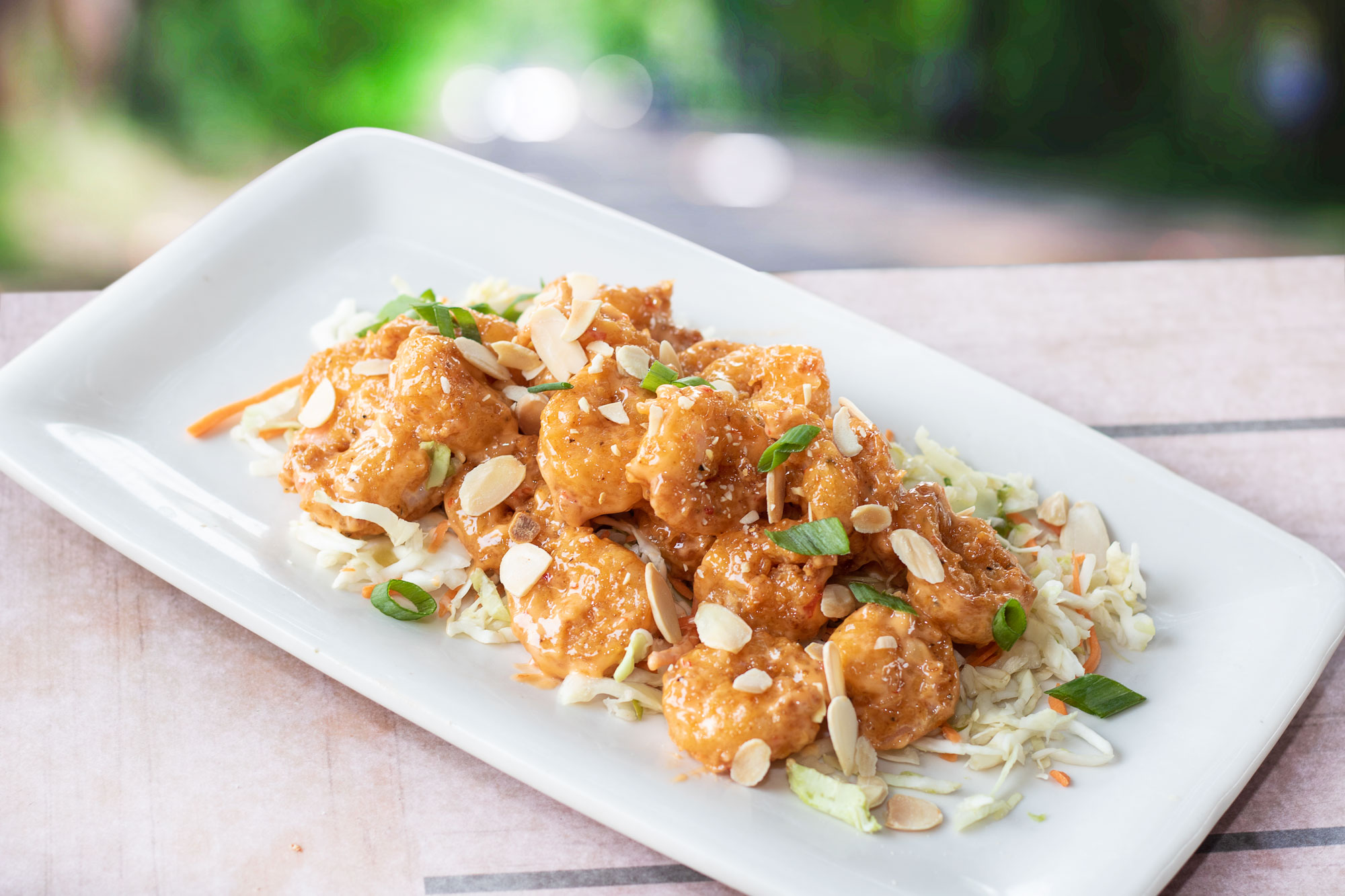 Fried shrimp tossed in our spicy & sweet volcano sauce, with toasted almonds & green onions