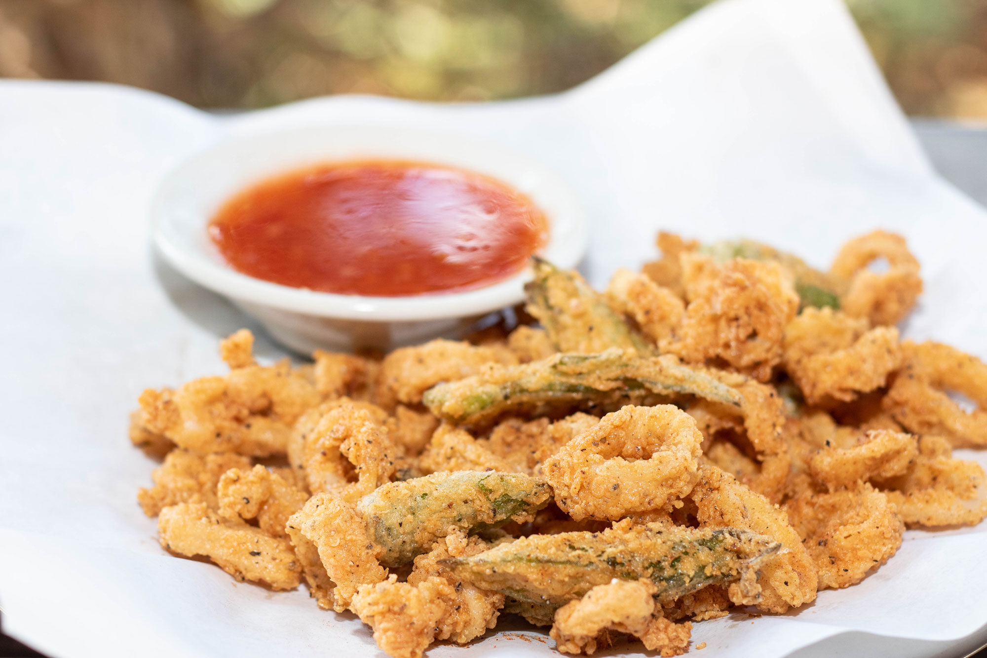 Hand breaded and flash-fried tender calamari & okra tossed with blackened seasoning and served with a side of marinara