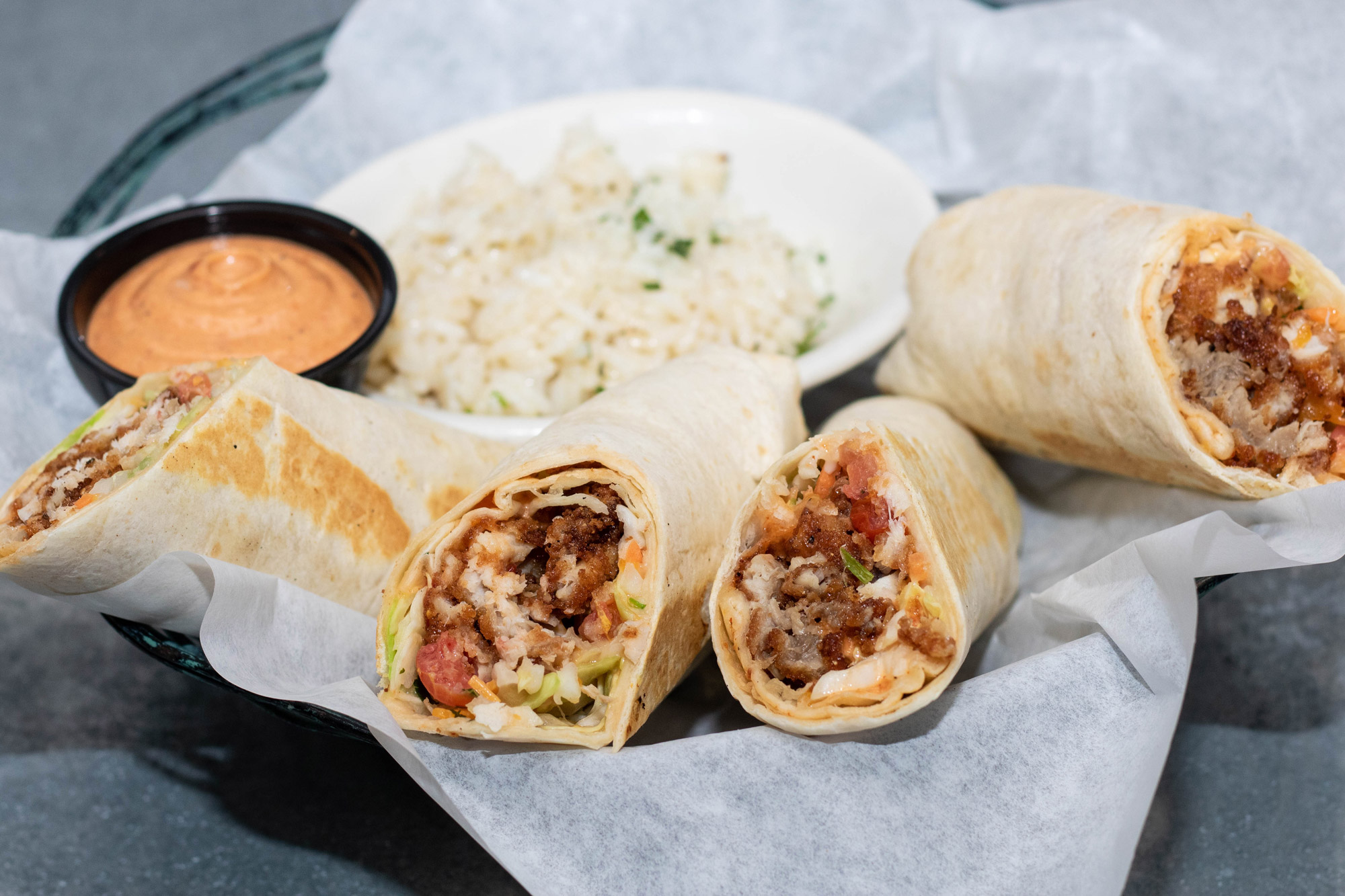 Your choice of fried Alaskan cod or shrimp with ancho aioli, cabbage, cheddar-jack cheese, pico de gallo, and a side of cilantro lime rice.