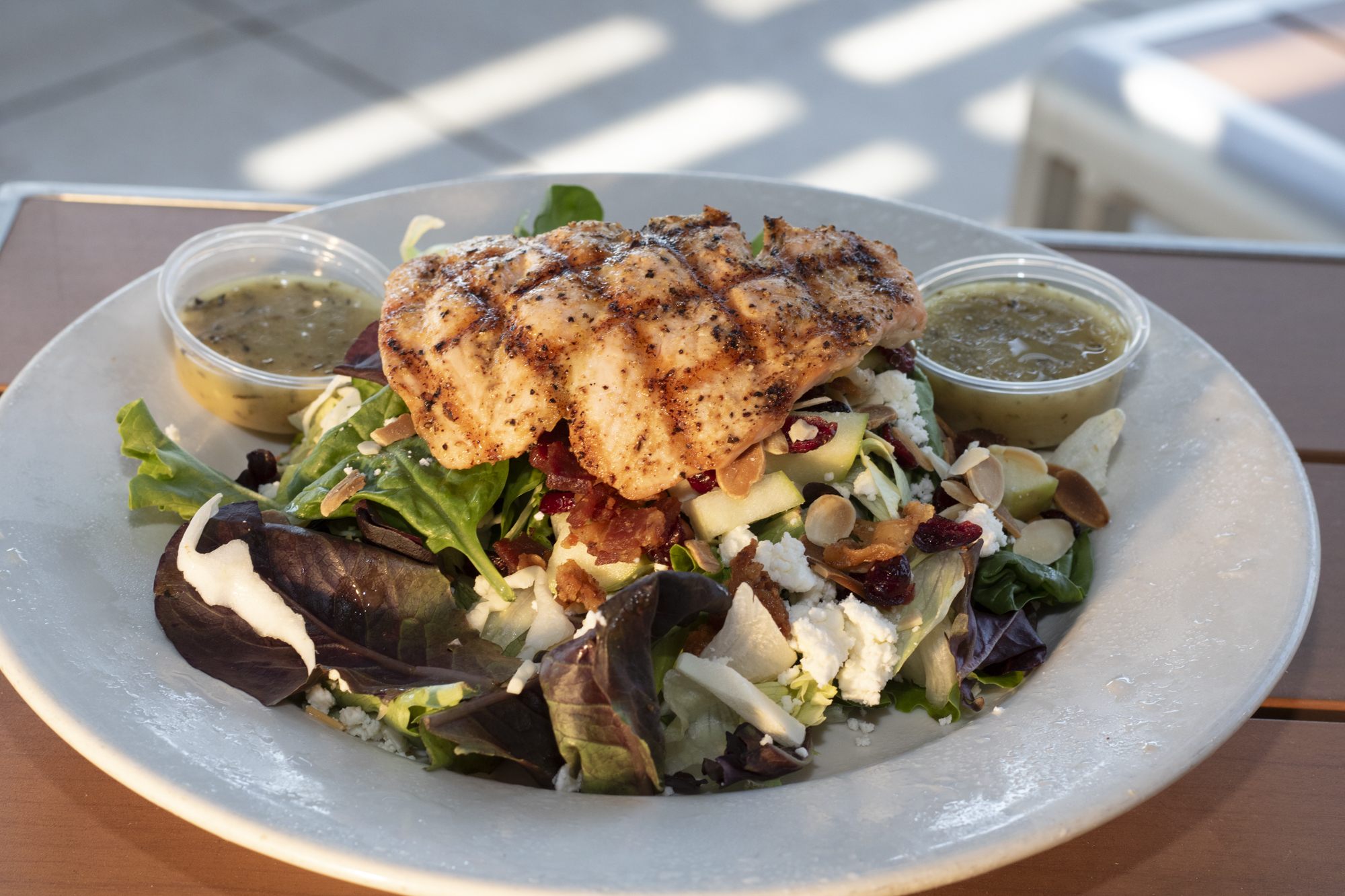 Mixed greens served with apples, cranberries, bacon, toasted almonds, feta, and herb vinaigrette