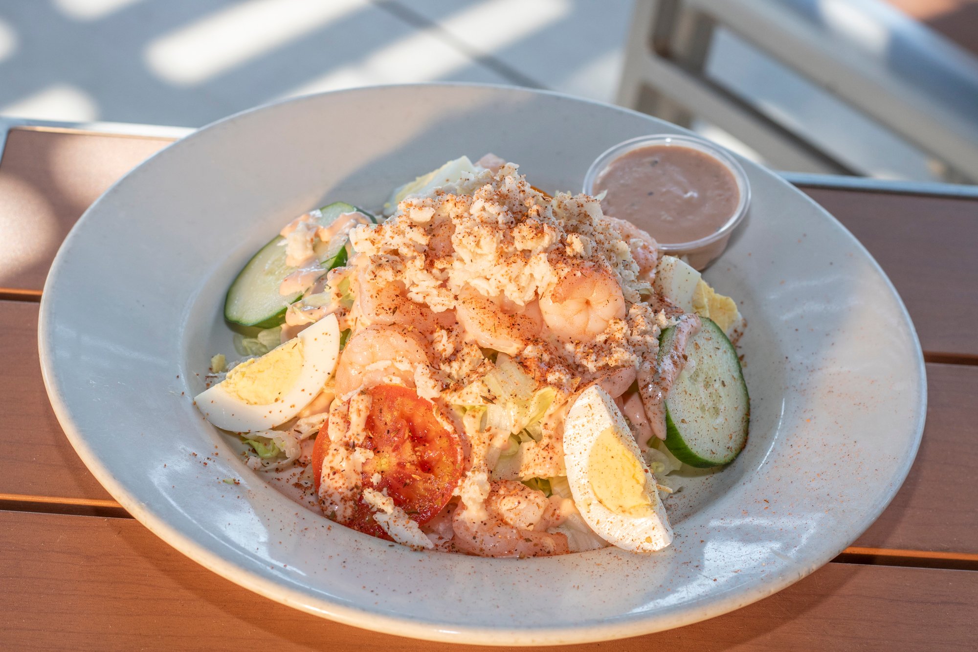 Jumbo lump crab, shrimp, and remoulade atop shredded lettuce with cucumber, tomatoes and egg