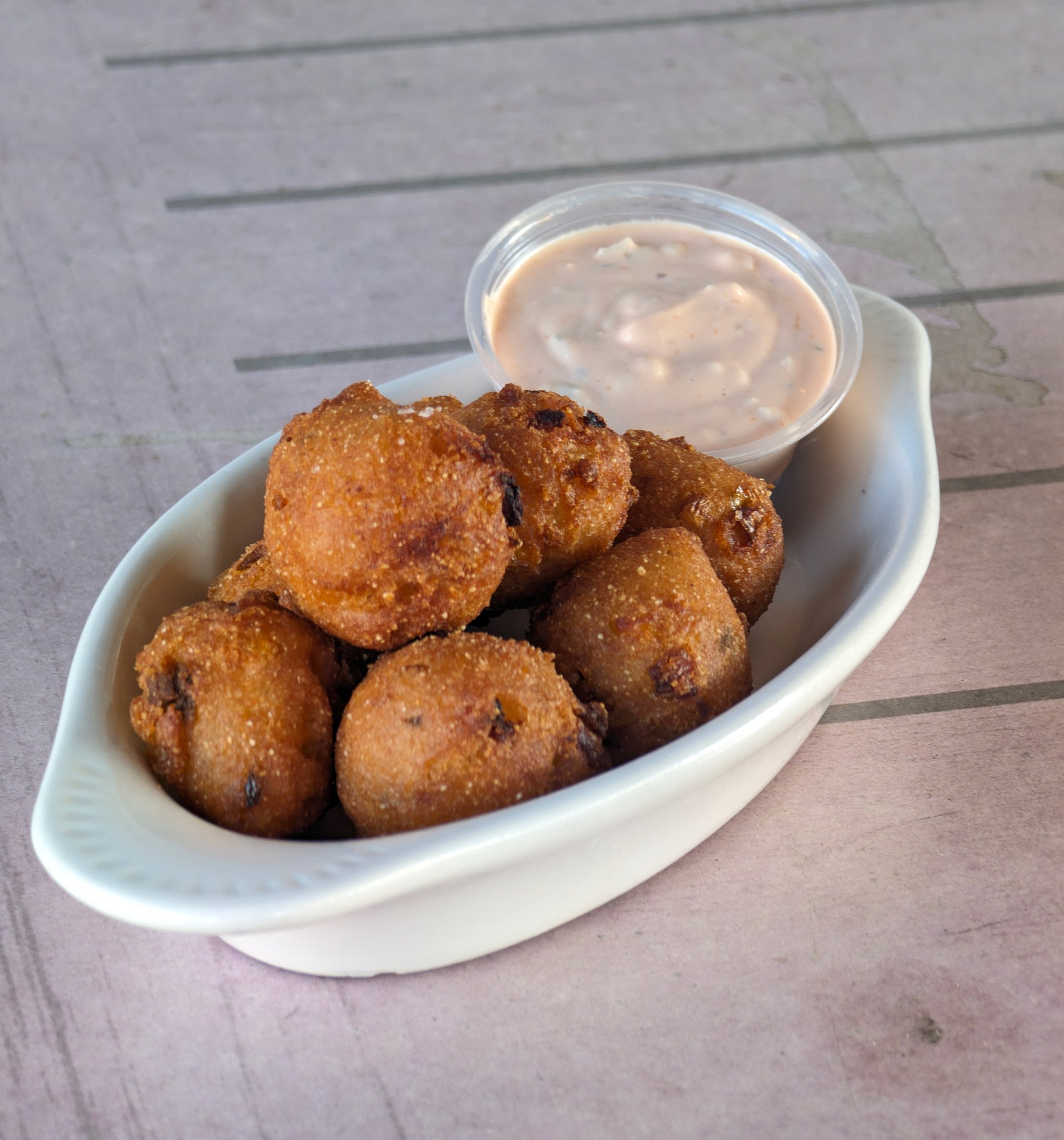 Our classic jalapeno hush puppies served with our homemade remoulade dressing