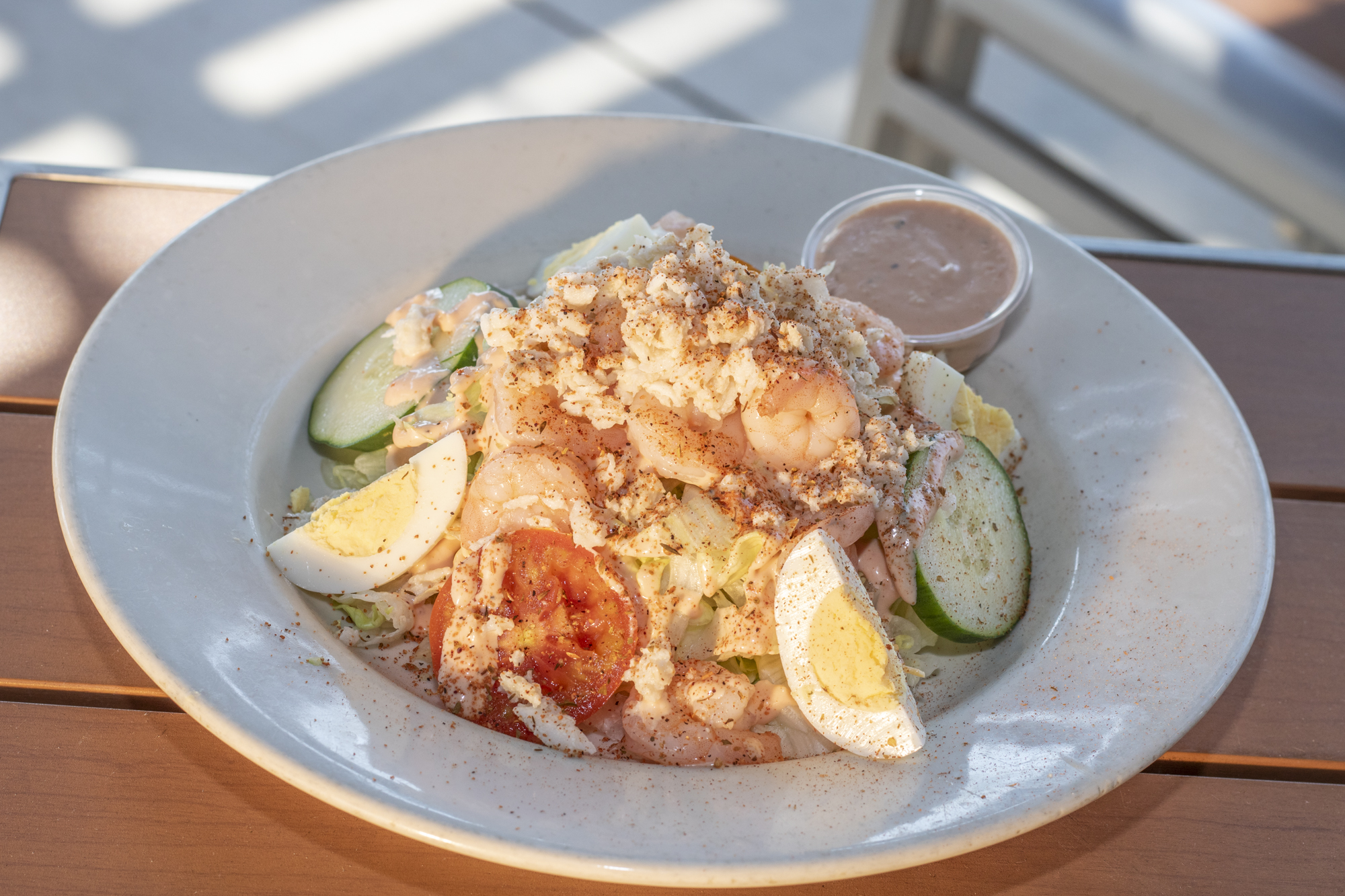 Jumbo lump crab, shrimp, and remoulade atop shredded lettuce with cucumber, tomatoes and egg