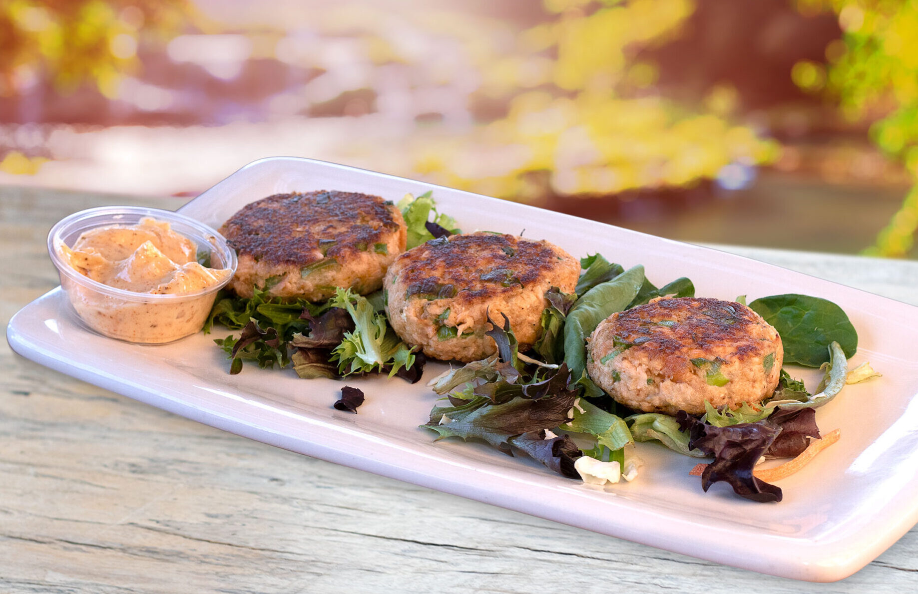 3 fresh made salmon cakes with our homemade Old Bay aioli