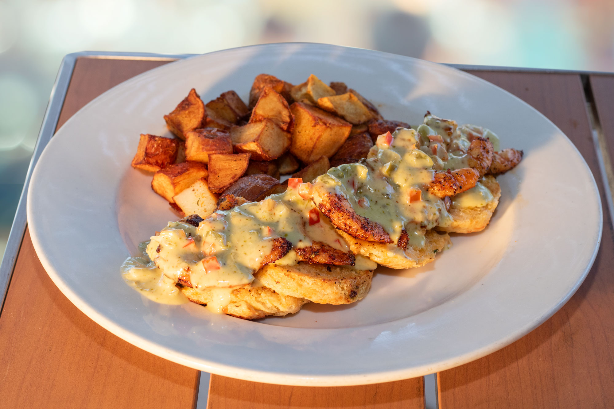 Two freshly baked jalapeno cheddar biscuits topped with eight large blackened shrimp and our creamy jalapeño gravy, served with breakfast potatoes.