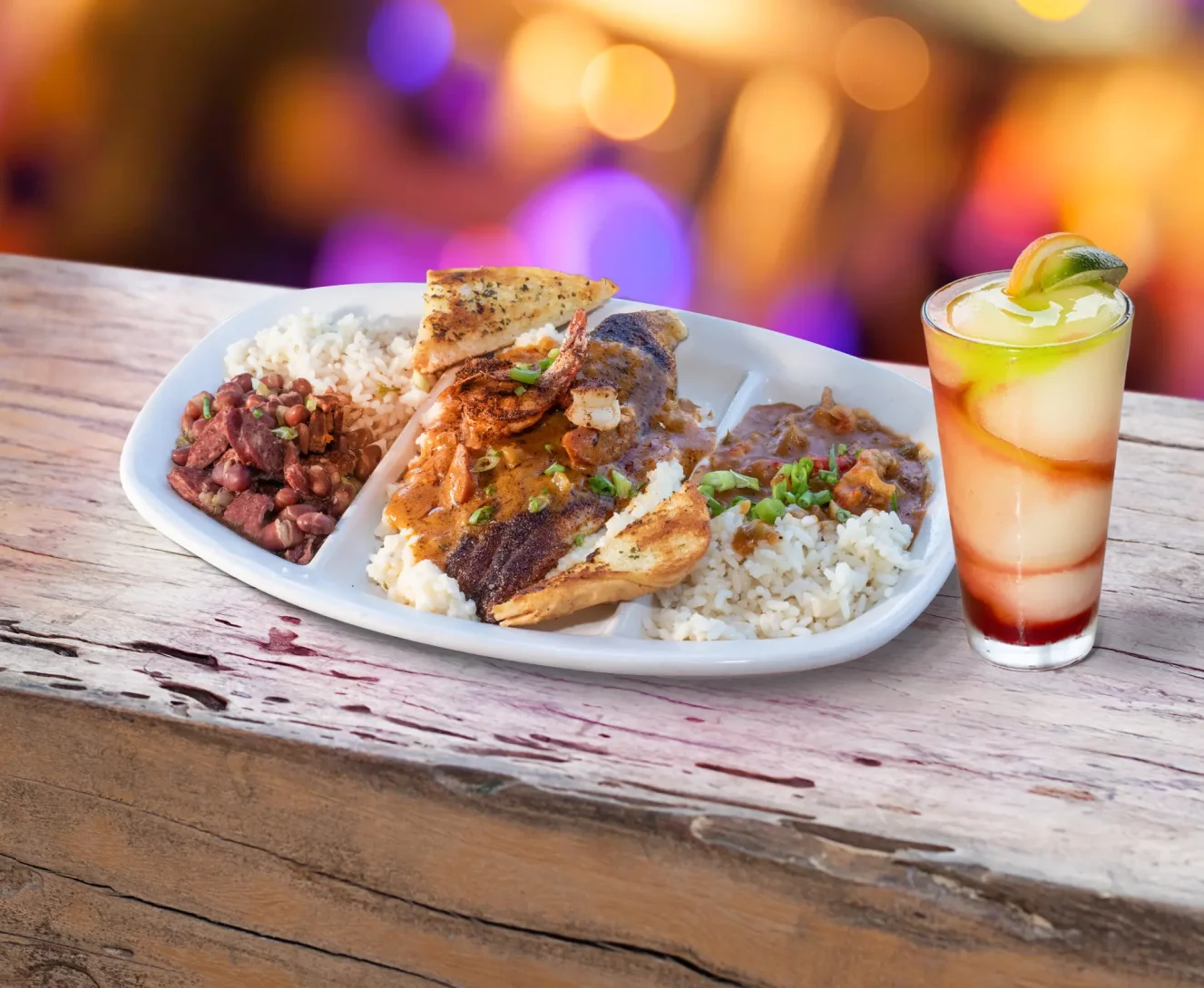 Blackened catfish topped with 2 large blackened shrimp, with jalapeno cheese grits smothered in andouille sausage gravy, plus our handcrafted crawfish etouffee and red beans and rice